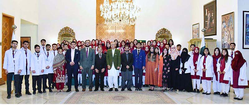 President Dr. Arif Alvi in a group photo with the medical students of Azad Jammu Kashmir Medical College, Muzaffarabad (AJKMC), who called on him, at Aiwan-e-Sadr