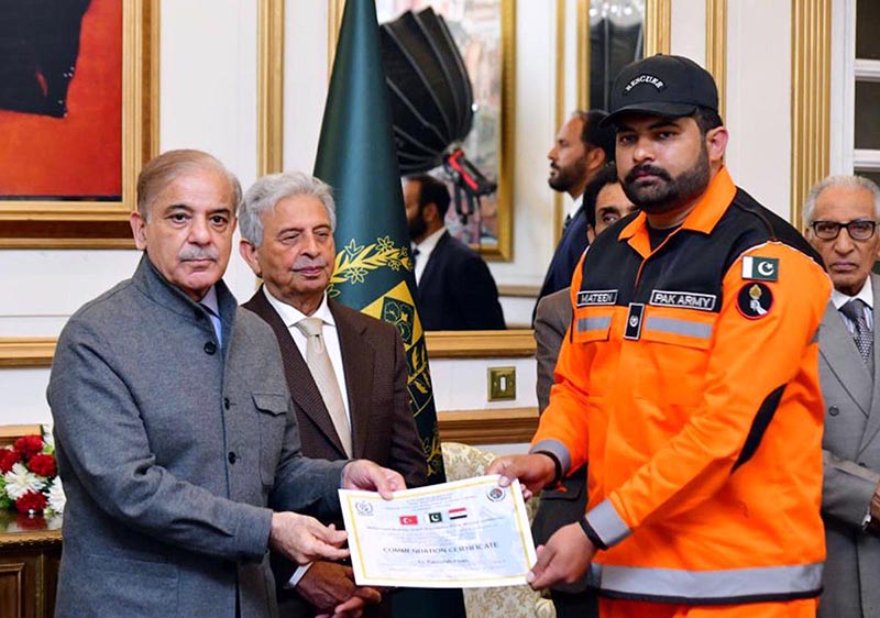 Prime Minister Muhammad Shehbaz Sharif distributing certificates of appreciation among the members of Pakistan's search and rescue teams who rendered services in the earthquake affected areas of Turkiye and Syria