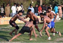 Lahore and Kasur kabaddi Players in action in a kabaddi match during Jashan-e-Baharan festival at Jillani Park organized by PHA