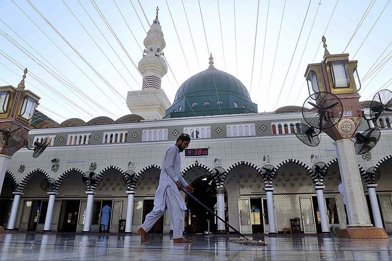 A man clean Masjid e Khizra at Sindh high court ahead of the Holy Islamic fasting month of Ramadan