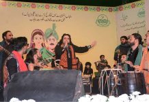 Folk singer Arif Lohar performing on stage during a Culture day
