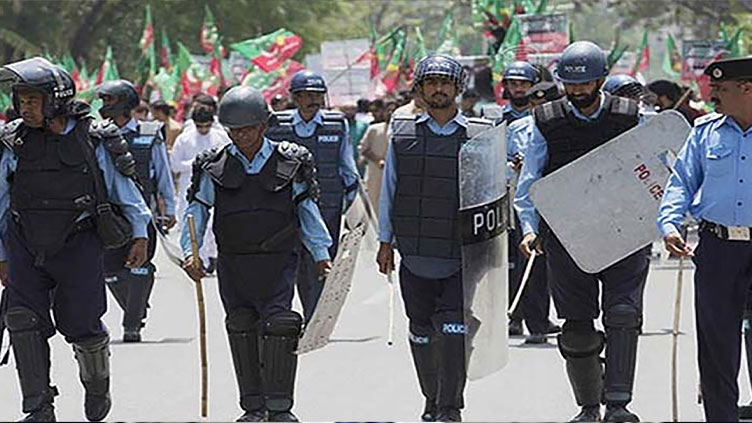 PTI workers clash with police, set picket on fire
