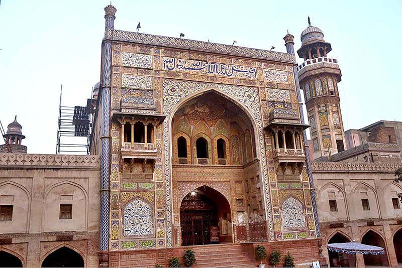 An outer view of entrance gate of Masjid Wazir Khan at walled city. The Wazir Khan Mosque is 17th century mosque. The mosque was commissioned during the reign of the Mughal Emperor Shah Jahan as part of an ensemble of buildings that also included the nearby Shahi Hammam baths. Construction of Wazir Khan Mosque began in 1634 C.E., and was completed in 1641.