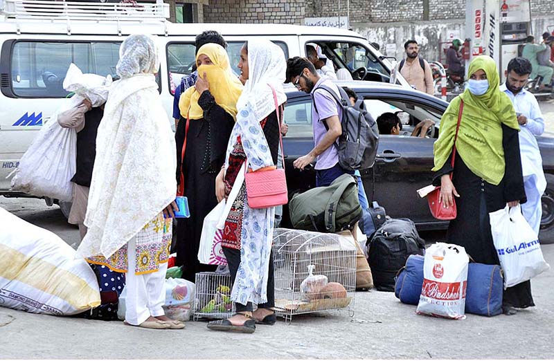 People are eagerly making their way home to celebrate the joyous occasion of Eid-ul-Fitr with their loved ones, carrying their belongings with them at Pirwadhai as the holy month of Ramadan is about to end