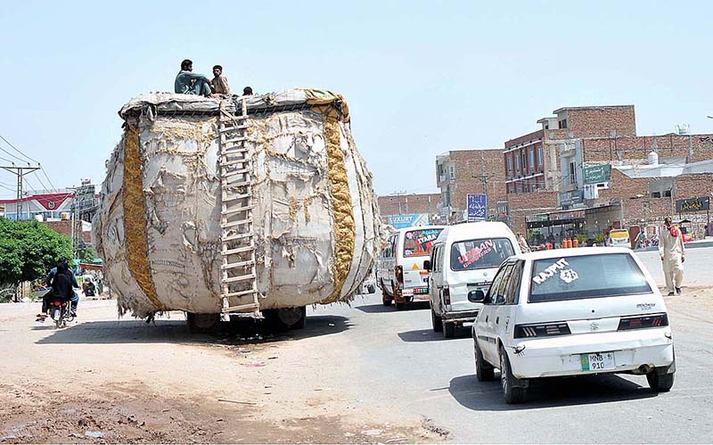 An overloaded tractor trolley with husk from wheat on the way may cause any mishap