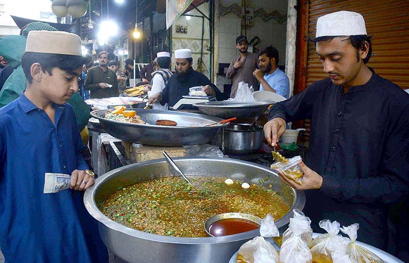 Vendor selling and displaying traditional food item chanay to attract the customers during the holy fasting month of Ramzan.