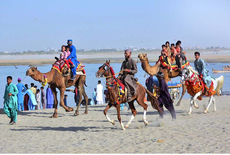 Women enjoy boat riding on the 3rd day of Eid ul Fitr festival in River Indus at Jamshoro