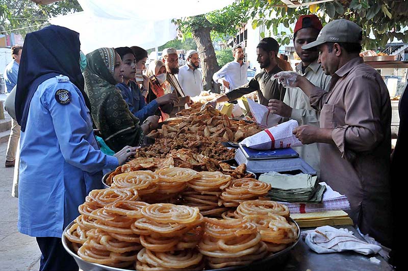 People purchasing traditional food stuff for iftar during the holy month of Ramadan