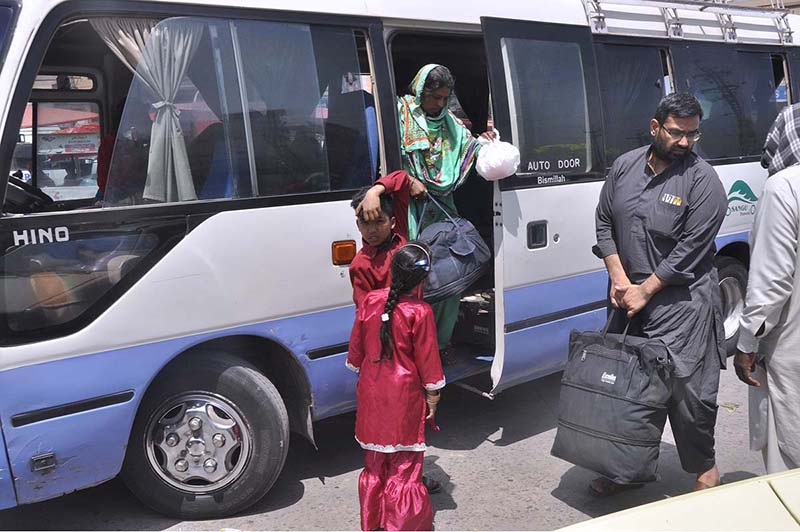 People arrive back to the city after spending Eid ul Fitr holidays in their hometowns