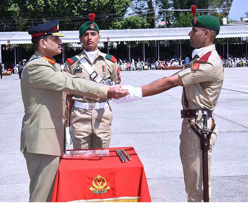COAS, General Syed Asim Munir, gives cane to a cadet during 147th PMA Long Course, 13th Mujahid Course, 66th Integrated Course, 6th Basic Military Training Course and 21st Lady Cadet Course at Pakistan Military Academy (PMA)