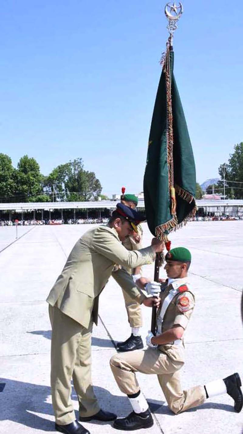 COAS, General Syed Asim Munir, confers flag to a cadet during 147th PMA Long Course, 13th Mujahid Course, 66th Integrated Course, 6th Basic Military Training Course and 21st Lady Cadet Course at Pakistan Military Academy (PMA)