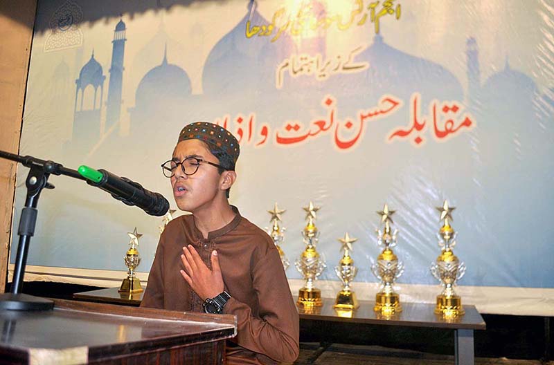 A boy reciting Naat during Azan and Naat competition organized by Anjam Art Society.