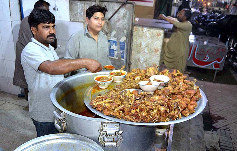 A vendor is displaying and selling traditional food for sehri at Anarkali Bazaar