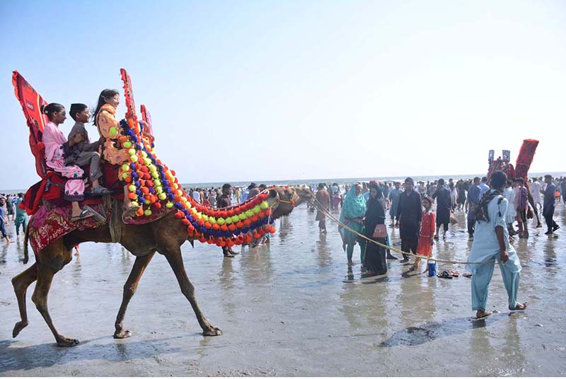 Children enjoying camel ride at Sea View Clifton on the 2nd day of Eid ul Fitr celebrations