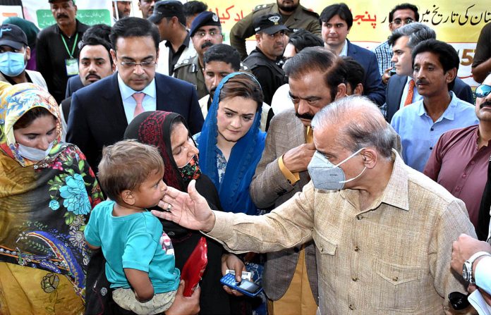PM visits free Atta distribution points