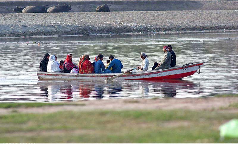 People enjoying riding on boat during boat tour in River Ravi in the provincial capital