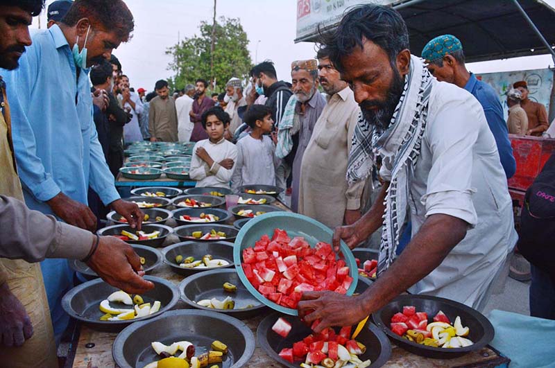 Volunteers preparing food for people to break their fast during holy month of Ramadan