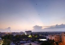 The sight of dark clouds looming in the sky during sunset is quite captivating