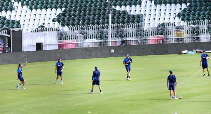 Pakistani and New Zealand cricket players taking part in a practice session at Pindi Cricket Stadium