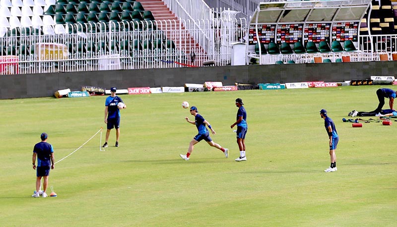Pakistani and New Zealand cricket players taking part in a practice session at Pindi Cricket Stadium