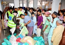 Workers of Alkhidmat Foundation distributing rashan bags to the deserving peoples during the Holy month of Ramzan at Alkhidmat Foundation Office