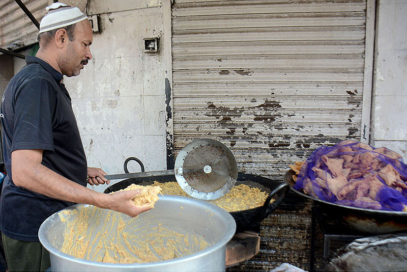 A vendors is making pakora for iftar during holy month of Ramadan