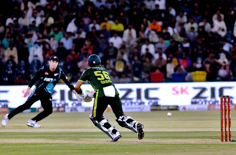 Pakistani Skipper Babar Azam waving bat to celebrate his century score during the 2nd Twenty20 match between Pakistan and New Zealand at the Gaddafi Cricket Stadium