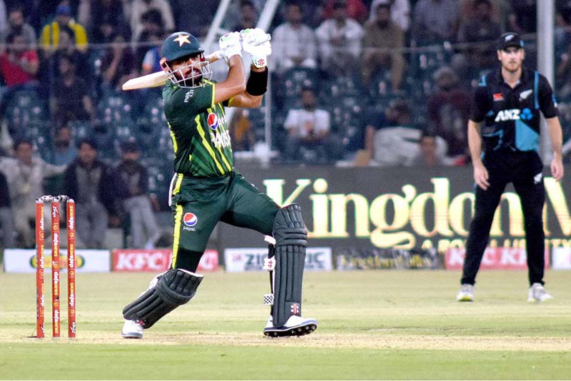 Pakistani Skipper Babar Azam waving bat to celebrate his century score during the 2nd Twenty20 match between Pakistan and New Zealand at the Gaddafi Cricket Stadium
