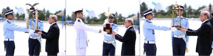 Prime Minister of Pakistan Muhammad Shehbaz Sharif awarding trophies to the distinction holders at the graduation ceremony held at PAF Academy Asghar Khan