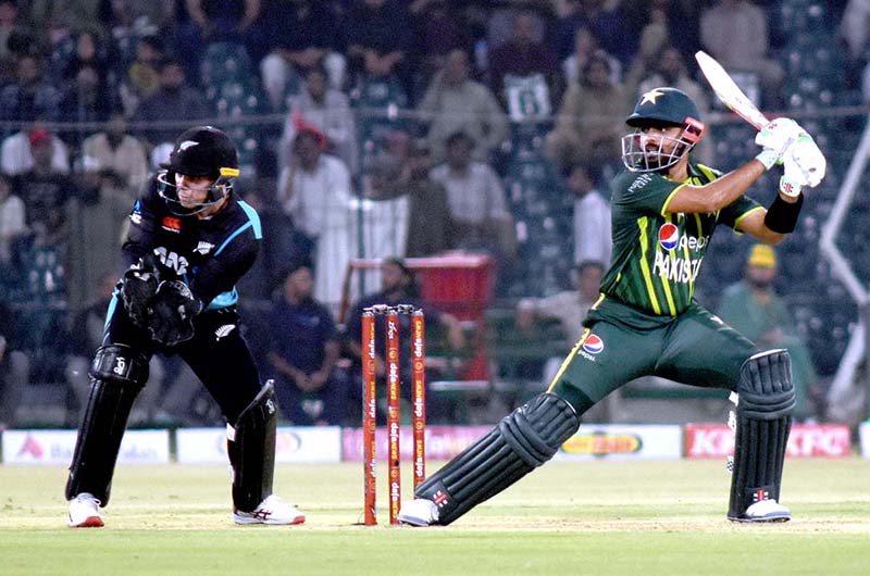 Pakistani Skipper Babar Azam waving bat to celebrate his century score during the 2nd Twenty20 match between Pakistan and New Zealand at the Gaddafi Cricket Stadium