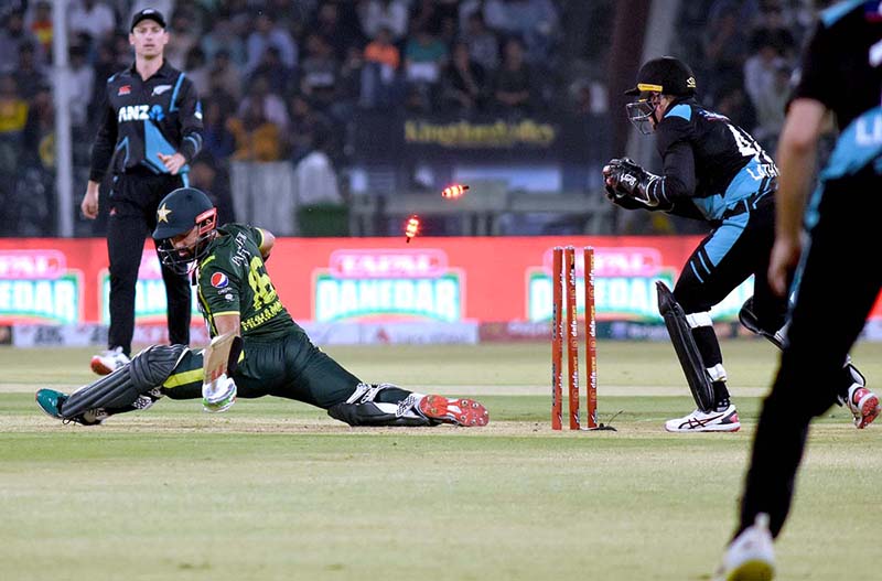 Pakistani Skipper Babar Azam waving bat to celebrate his century score during the 2nd Twenty20 match between Pakistan and New Zealand at the Gaddafi Cricket Stadium