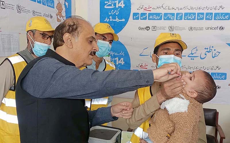 Chief Secretary Gilgit-Baltistan Mohyuddin Ahmad Wani administering polio drops to a child after inaugurating the EPI Center in Government Colony