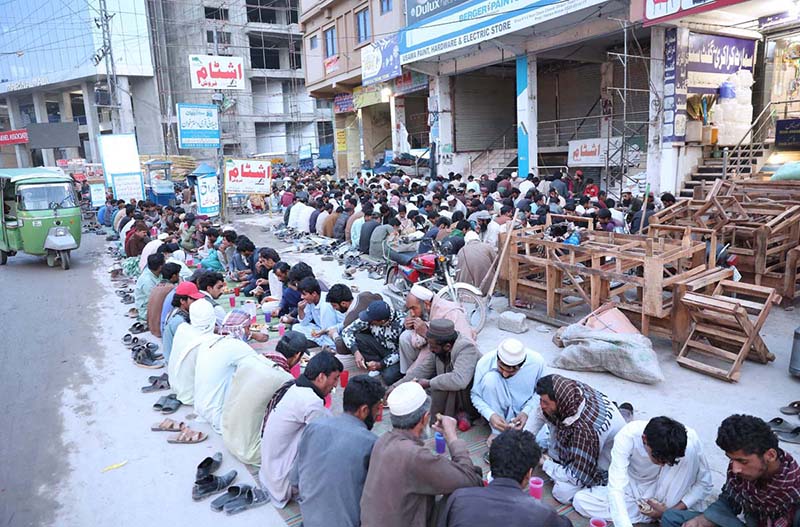 People praying before breaking their fast at Ghouri Town