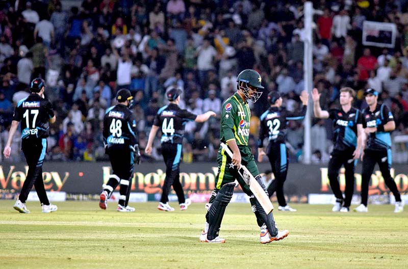 Pakistani Skipper Babar Azam waving bat to celebrate his century score during the 2nd Twenty20 match between Pakistan and New Zealand at the Gaddafi Cricket Stadium