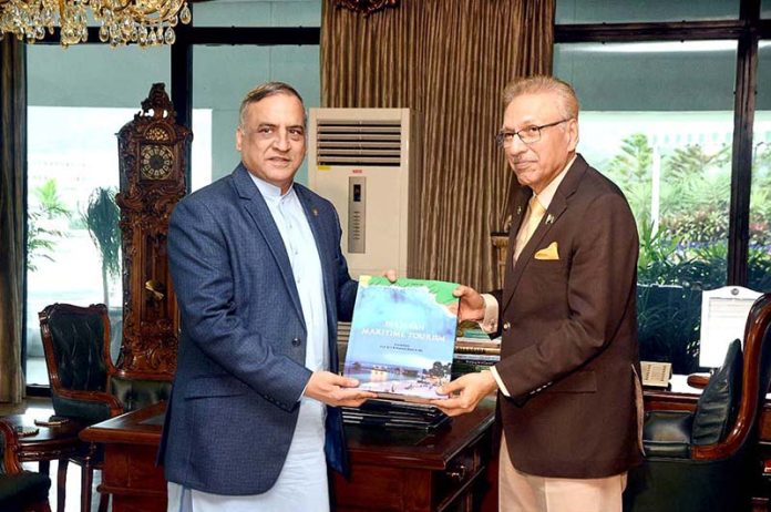 Dr. S M Shehzad presenting his book ''Pakistan Maritime Tourism'' to President Dr. Arif Alvi at Aiwan-e-Sadr