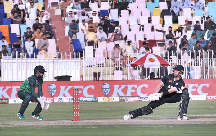 The Pakistani and New Zealand cricket players are seen in action during the first One Day International (ODI) match held at the Pindi Cricket Stadium