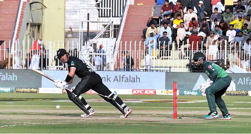 The Pakistani and New Zealand cricket players are seen in action during the first One Day International (ODI) match held at the Pindi Cricket Stadium