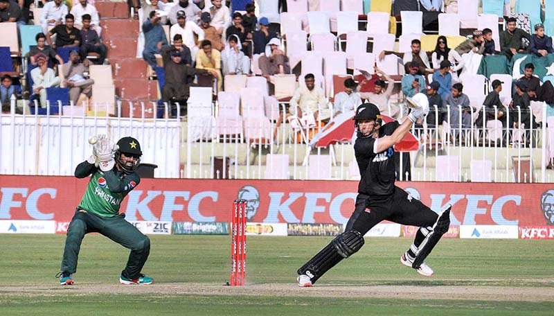 The Pakistani and New Zealand cricket players are seen in action during the first One Day International (ODI) match held at the Pindi Cricket Stadium