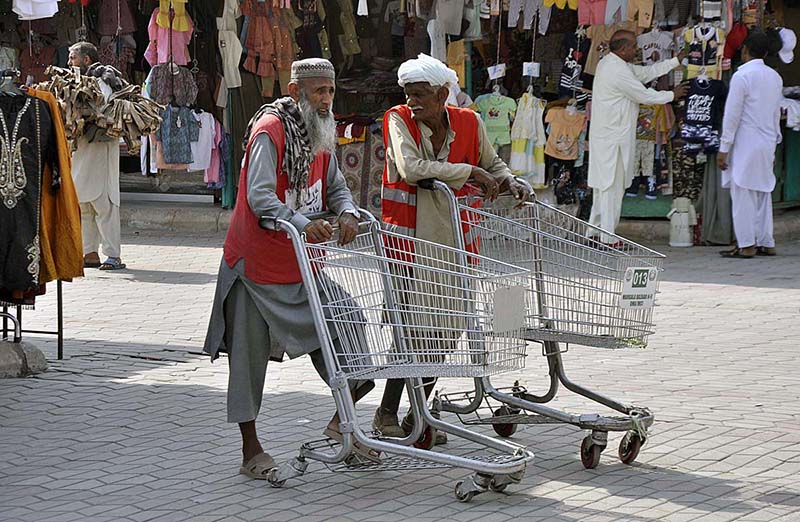 Laborers waiting for customers as the world marks International Labour Day. May 1st, International Workers' Day, commemorates the historic struggle of working people throughout the world. In 1884, the Federation of Organized Trades and Labour Unions passed a resolution stating that eight hours would constitute a legal day's work from and after May 1, 1886