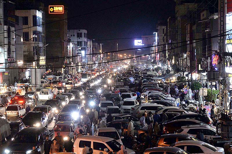 A view of massive traffic jam at Sadar Road as a large number of people throng to markets for Eid shopping for upcoming Eid-ul-Fitr