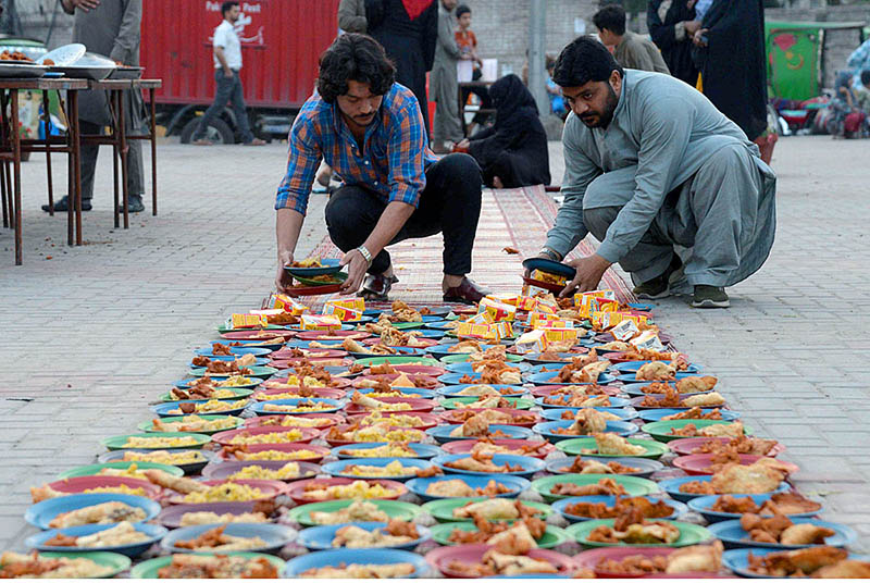Volunteers preparing food for people to break their fast during holy month of Ramadan