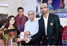Pakistan Cricket Team's fast bowler Shahnawaz Dahani giving away shield to student during Prize Distribution Ceremony of Annual Sports Week 2023 at Chandika Medical College
