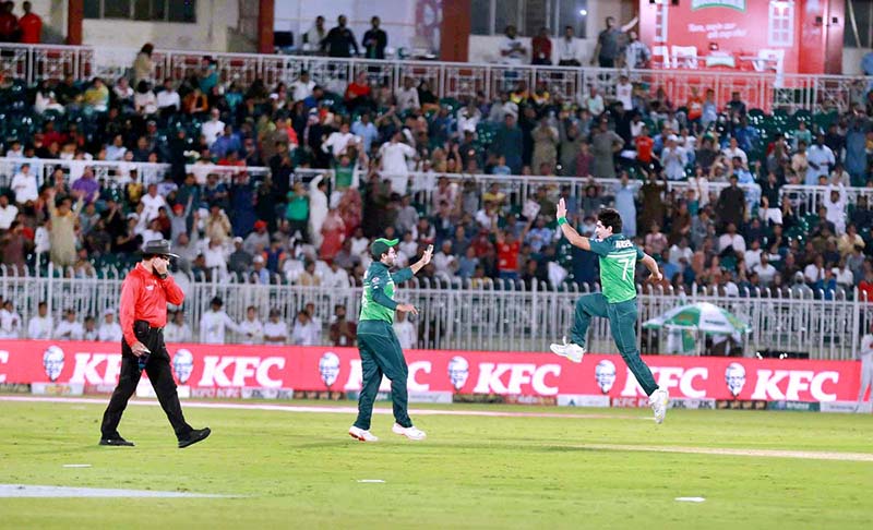 The Pakistani and New Zealand cricket players are seen in action during the first One Day International (ODI) match held at the Pindi Cricket Stadium