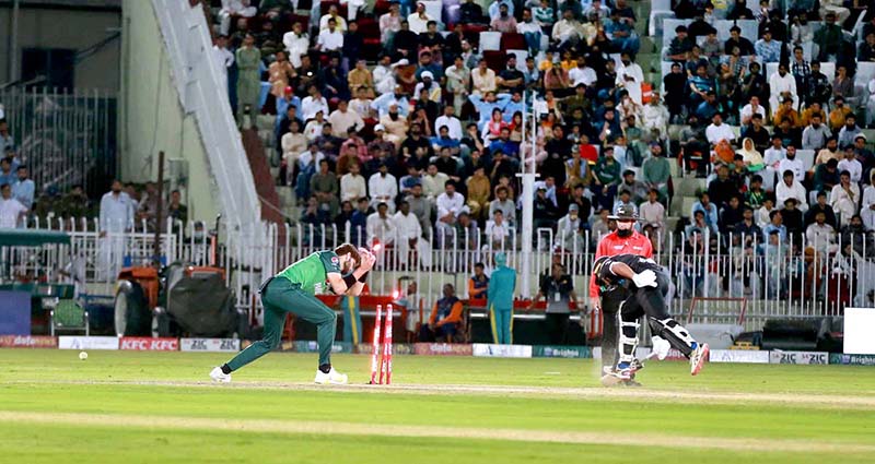 The Pakistani and New Zealand cricket players are seen in action during the first One Day International (ODI) match held at the Pindi Cricket Stadium