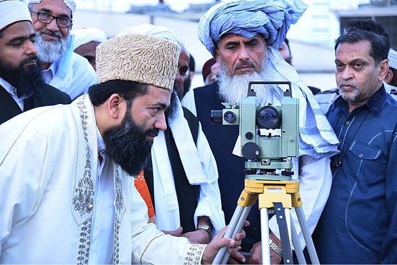 Chairman of Central Ruet-e-Hilal Committee, Maulana Abdul Khabeer Azad along with other members sighting for Shawal moon from the rooftop of Religious Affairs building to decide the celebration day of Eid-ul-Fitr