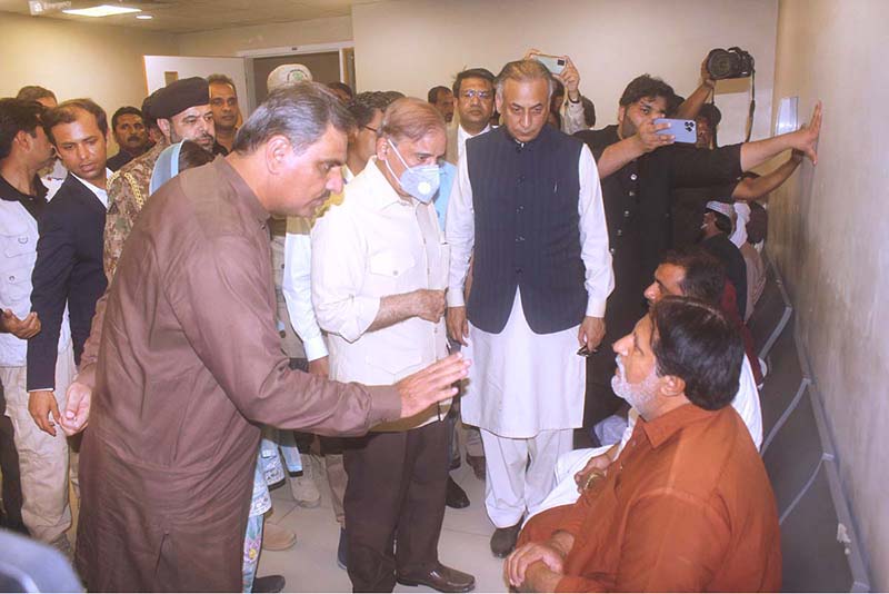 Prime Minister Muhammed Shehbaz Sharif talking with the patient during his visit at Rajab Tayyab Erdogan Hospital