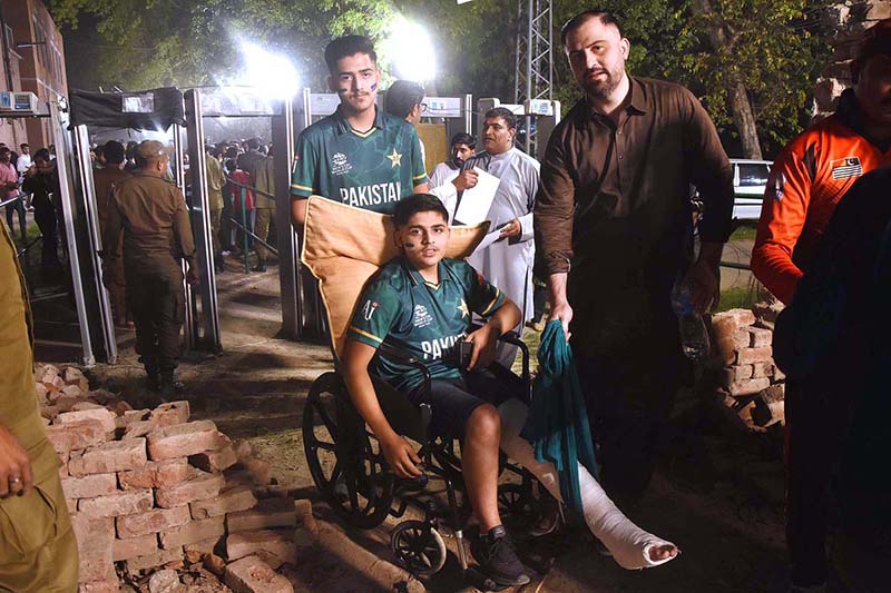 An injured cricket lover in the stadium to watch the Twenty20 match between Pakistan and New Zealand at the Gaddafi Cricket Stadium