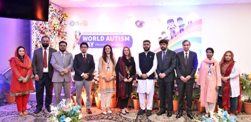 First Lady Begum Samina Alvi in a group photo with medical professionals at an awareness seminar in connection with Autism Spectrum Disorder at a hospital in Islamabad.