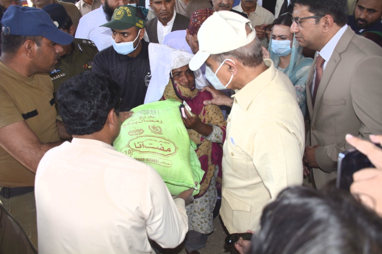 PM visits free flour distribution center