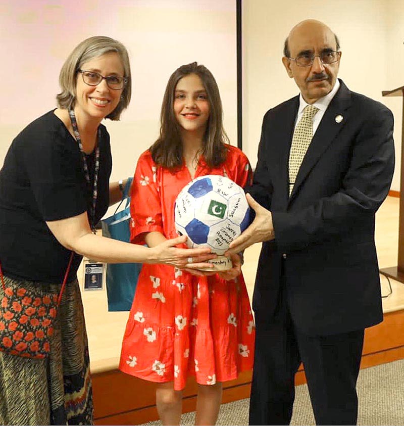 5th grade students of Janney Elementary School handover their token of appreciation to Ambassador Masood Khan. It is a football (Pakistan is famous for its footballs) with Pakistani flag and the students’ individual signature on it